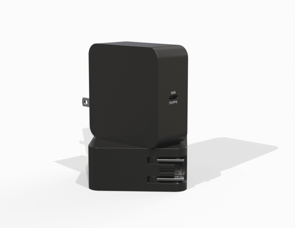 a black rectangular object with a plug in