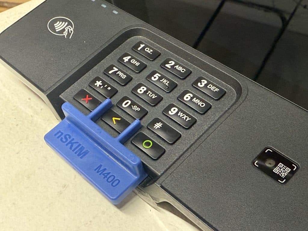 credit card pin pad with blue plastic inside chip slot